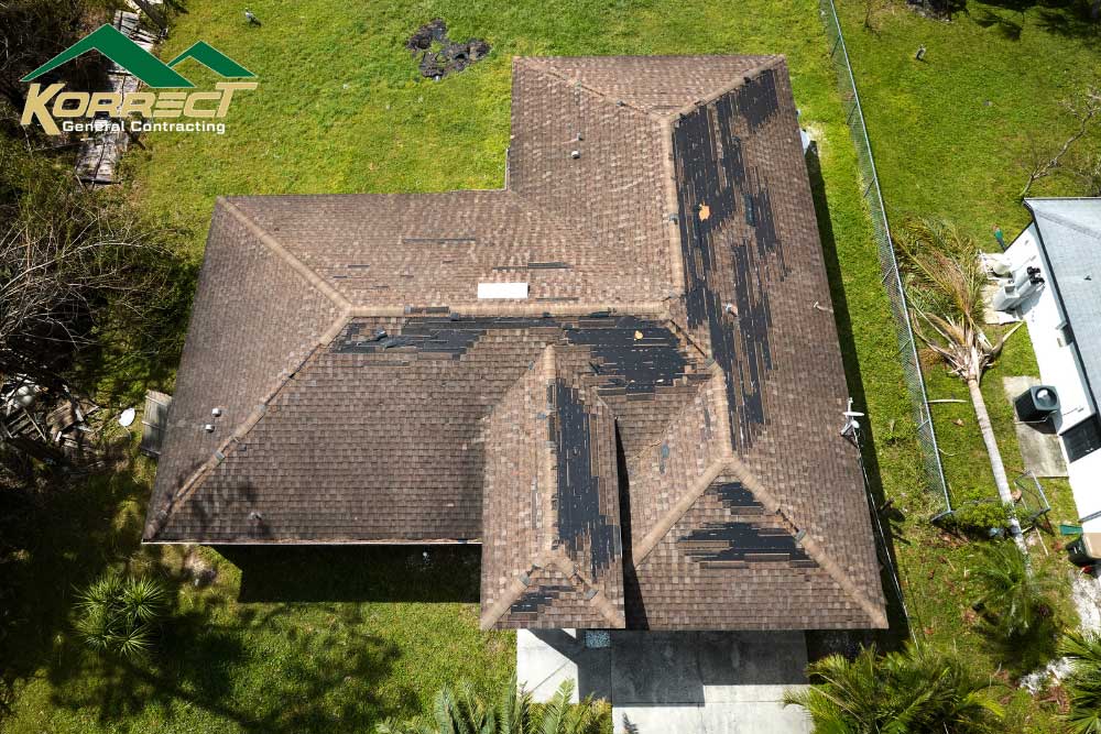 Aerial drone photo of damaged roof shingles during inspection in Fort Worth, captured by Korrect General Contracting.