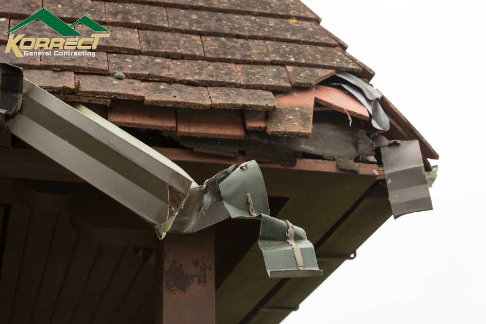 Broken gutter and roof edge damage showing the need for roof inspection and repair in DFW.